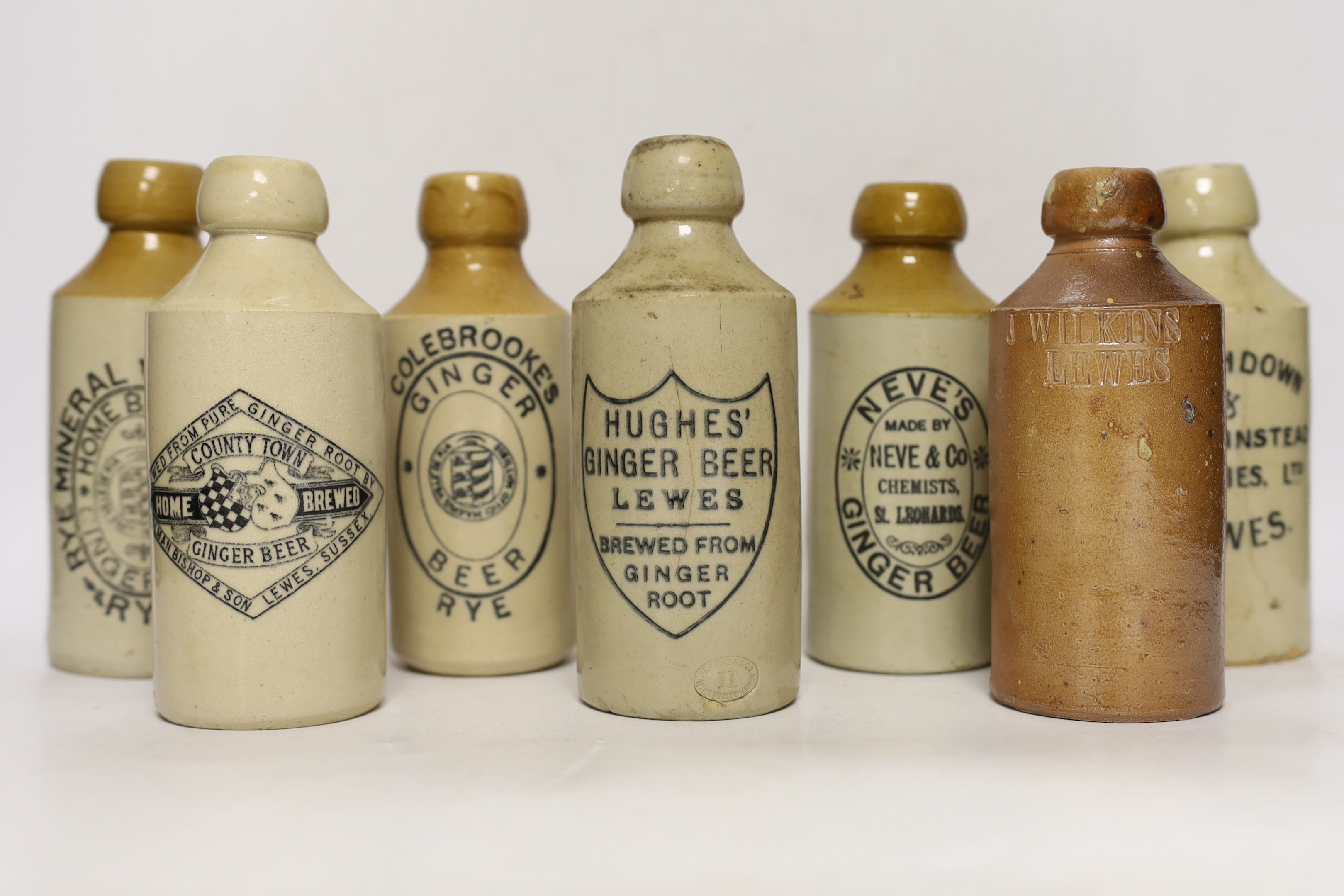 Early 20th century stoneware ginger beer bottles, four from Lewes, three from Hastings, two from Rye and one from St Leonards (10)